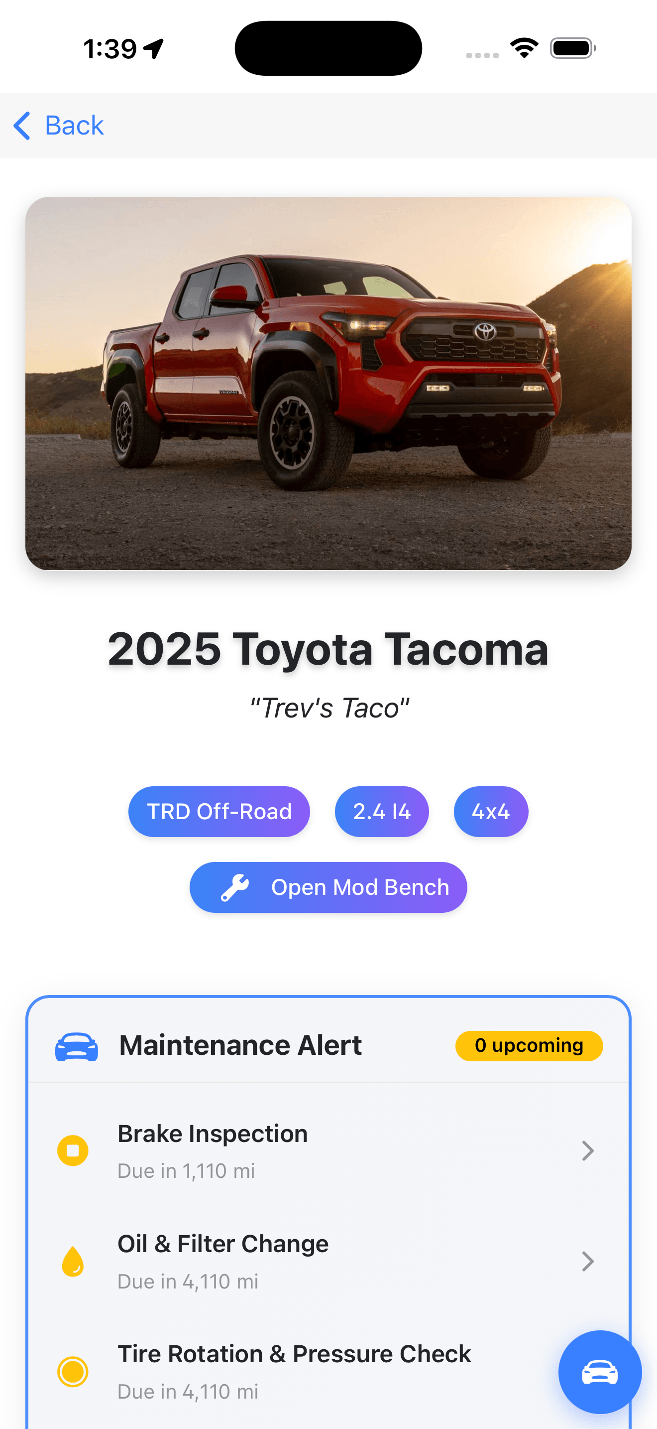 Garage with vehicle photo and maintenance alerts
